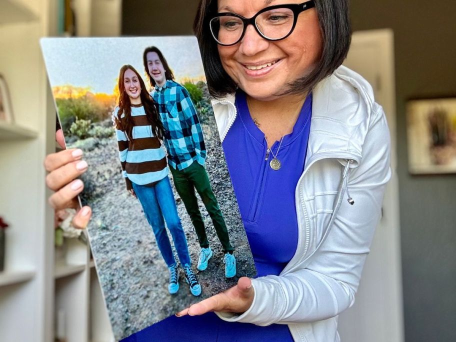 Woman holding a Walgreens metal Photo print