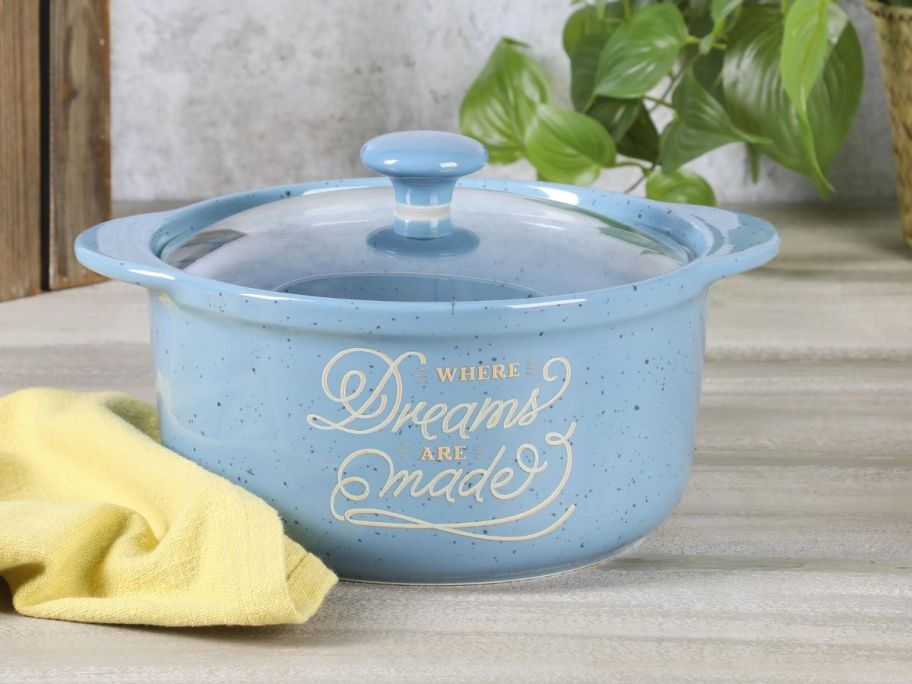 Wanda June Home Where Dreams Are Made Blue 2.3-Quart Stoneware Casserole on counter