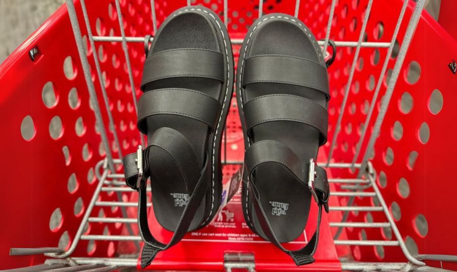 a pair of black leather strap sandals in a target shopping cart