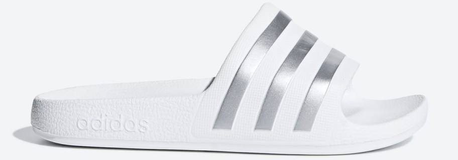 white adidas slide with silver stripes