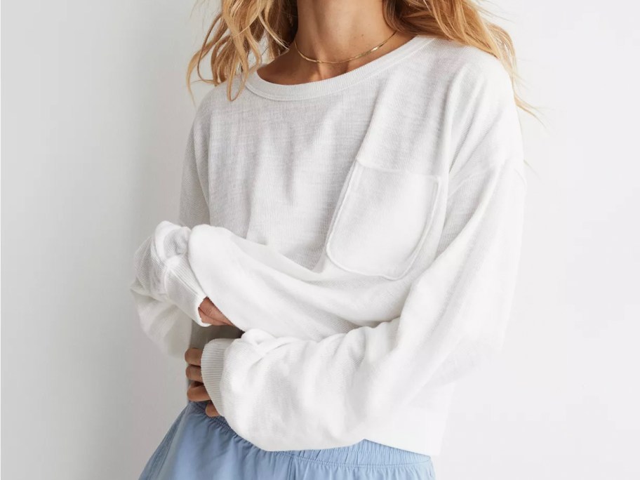 woman wearing white sweatshirt