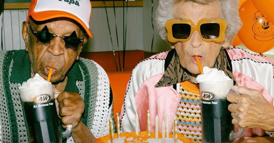 man and woman drinking root beer floats 