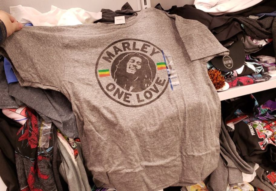 a bob marley graphic tee on a shelf in a target store