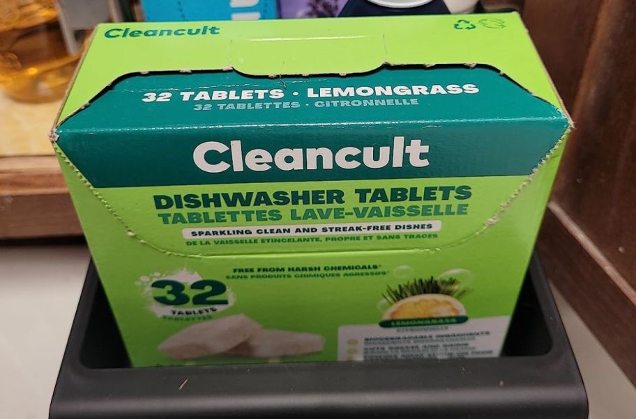 a box of cleancult dishwasher tabs in a kitchen cabinet