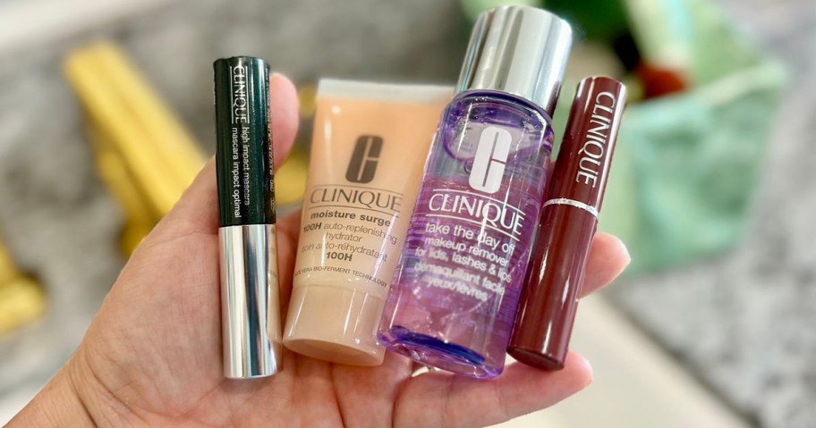 hand holding clinique beauty products 