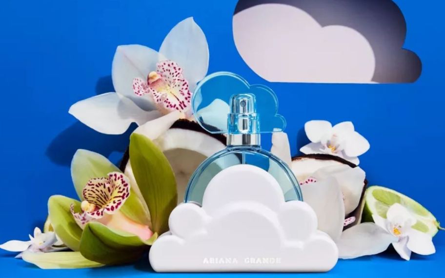 ariana grande clous perfume shown with orchids