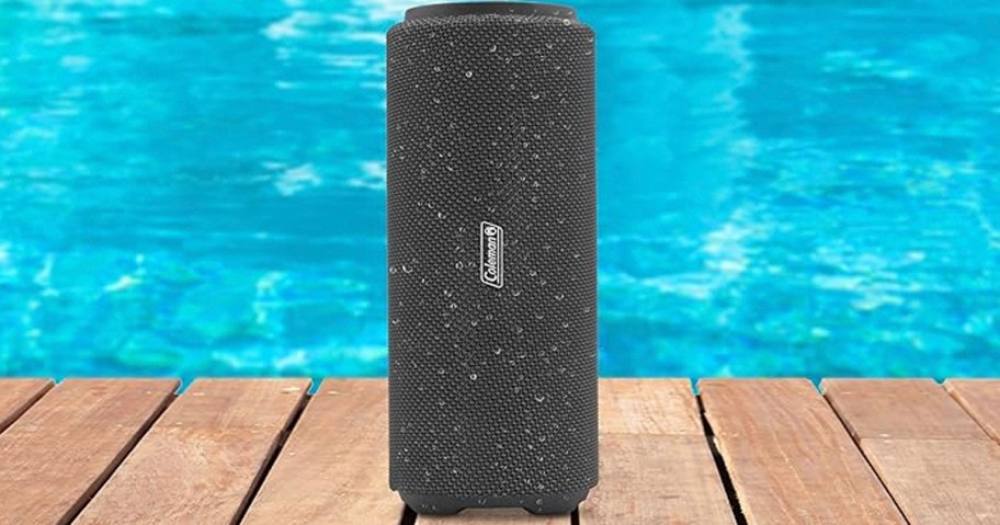 coleman speaker sitting by pool with water