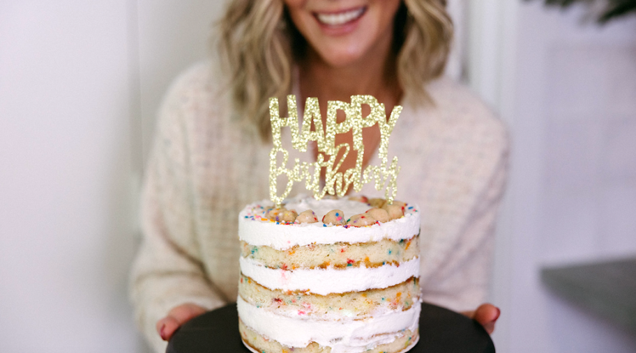 woman holding birthday cake