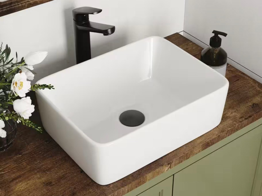 white rectangle liberty sink with black faucet