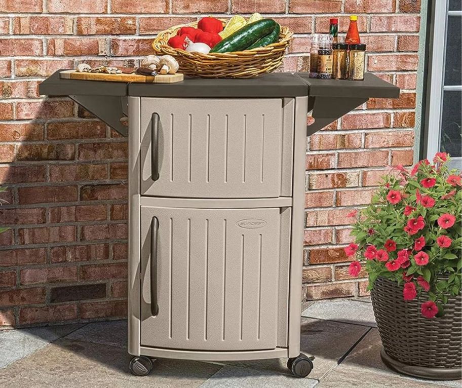 a brown bar cart on a patio