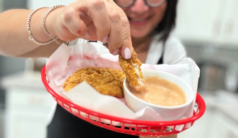 dipping walmart famous chicken tenders into homemade cane's sauce