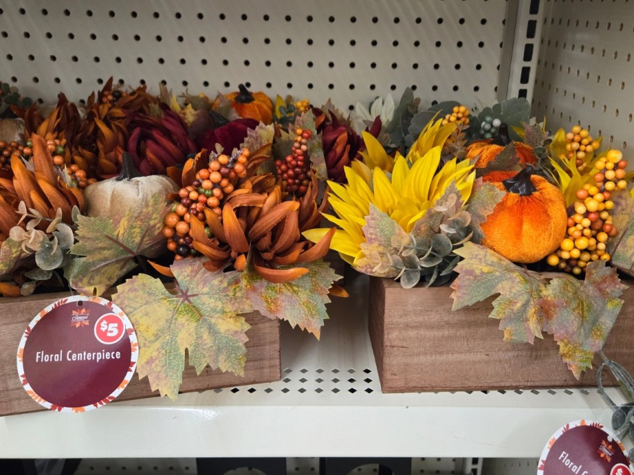 decorative fall floral centerpieces in a wood box on shelf