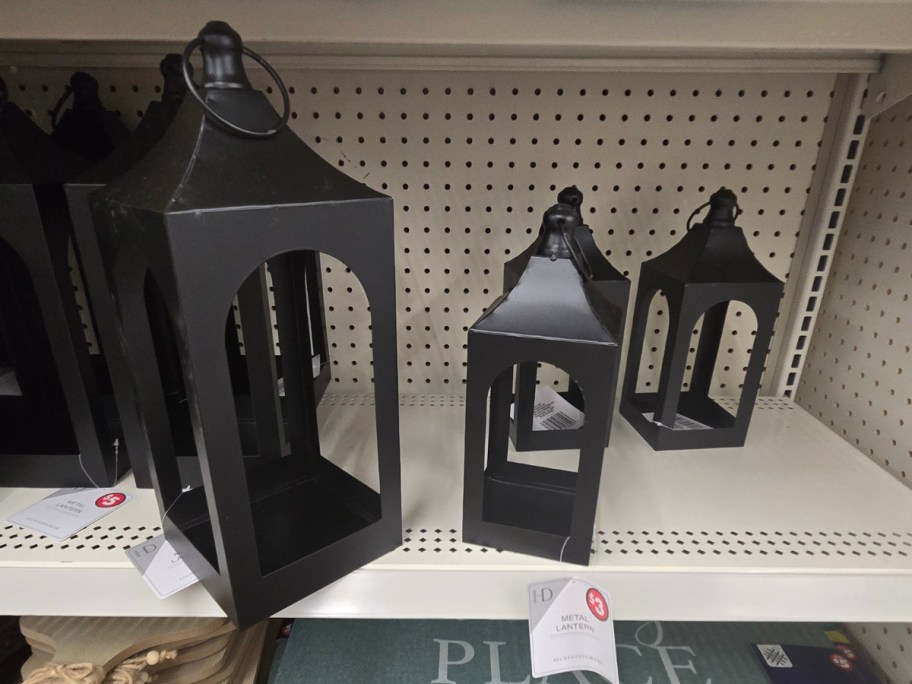 large and medium size black Metal decorative lanterns on a store shelf