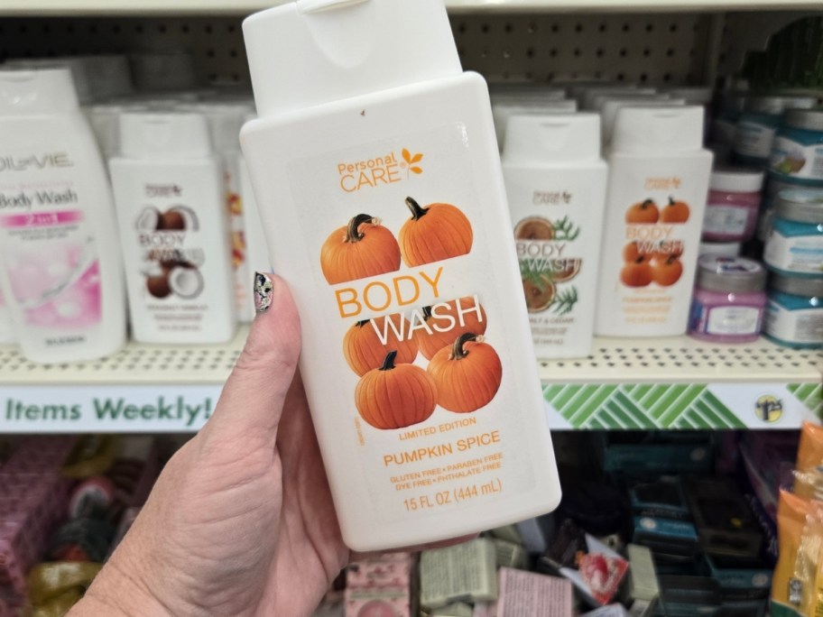hand holding a bottle of Pumpkin Spice Body Wash
