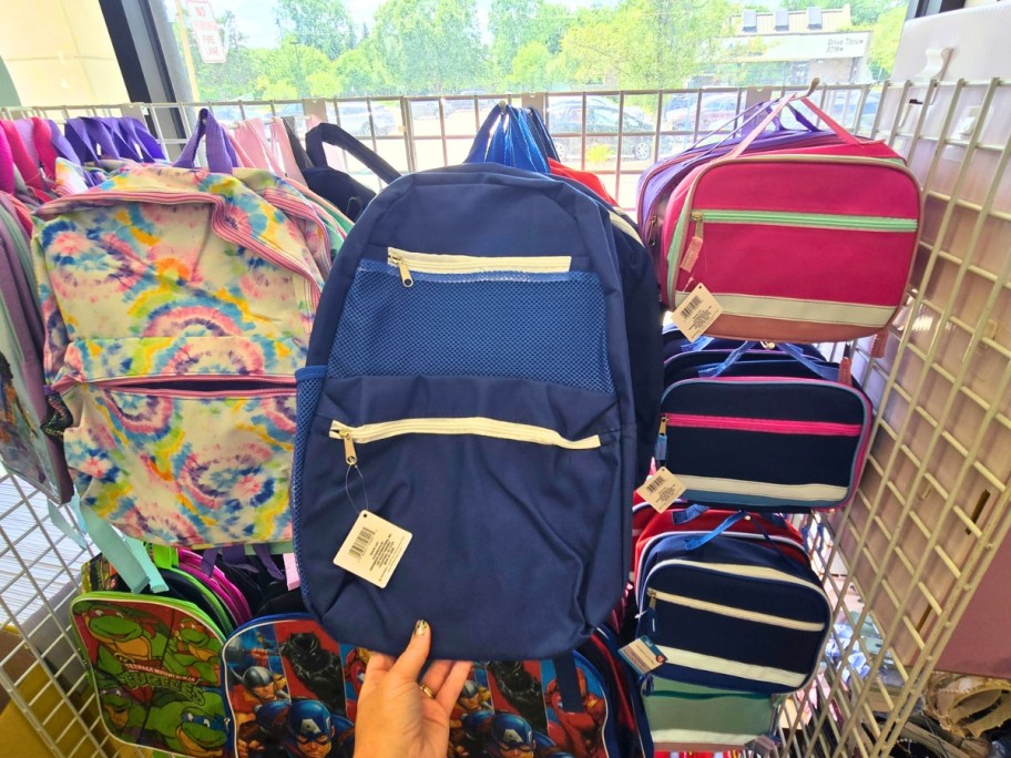 Kid's backpacks and lunchboxes on display in Dollar Tree