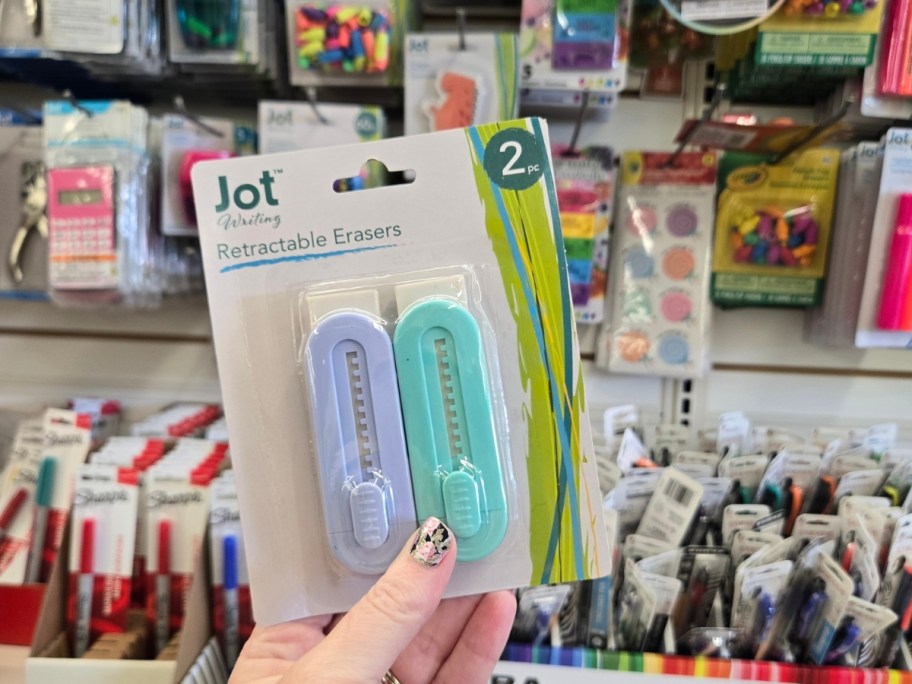 hand holding a pack of 2 Jot Pastel Retractable Erasers