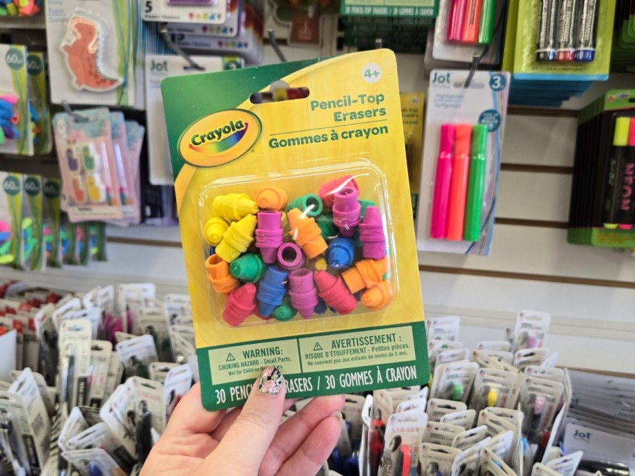 hand holding a pack of Crayola Colorful Pencil Top Erasers