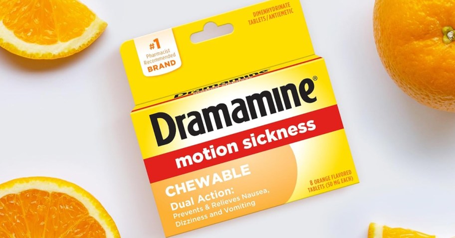 box of dramamine motion sickness chewable tablets next to oranges