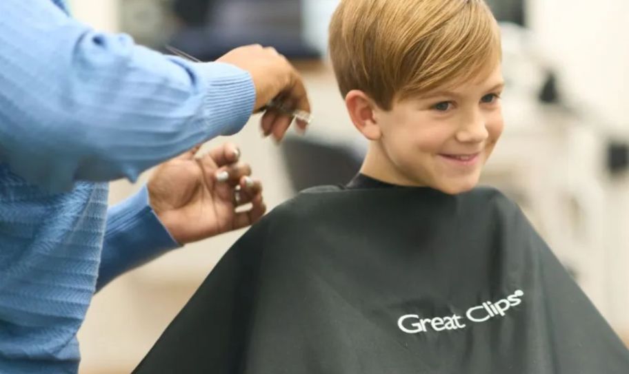 little boy getting his hair cut at great clips