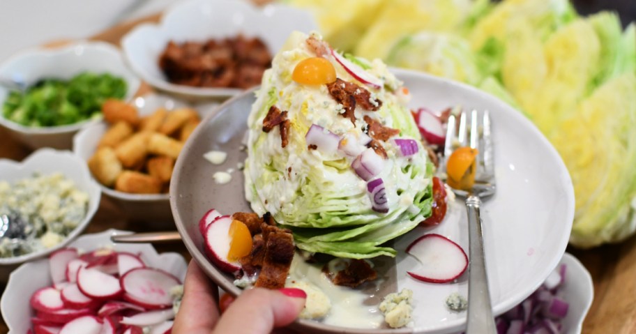 holding a plate with wedge salad
