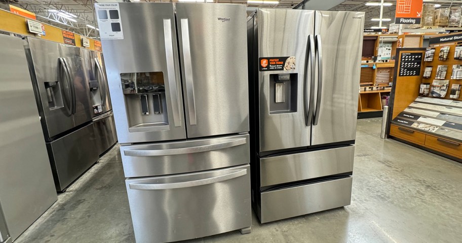 two stainless steel refrigerators in home depot store 