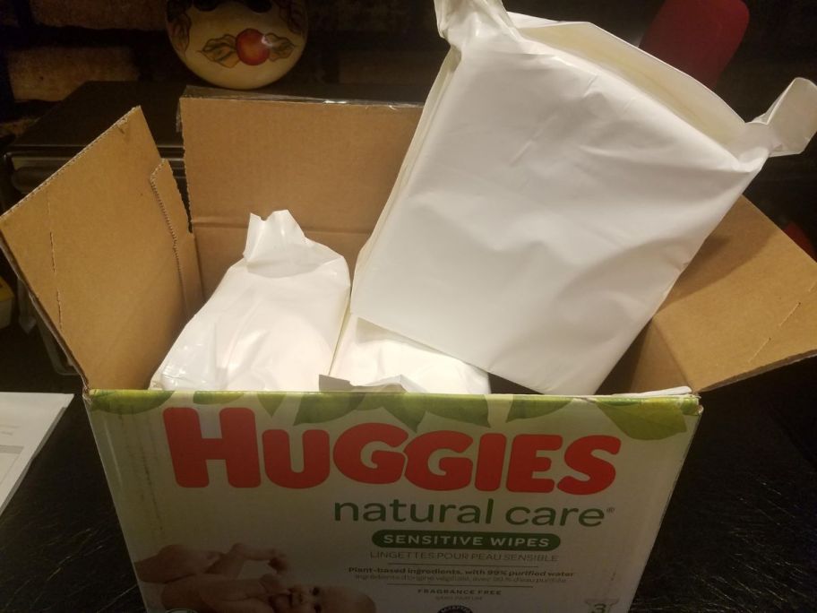 a box of 3 refill packs of huggies natural care baby wipes