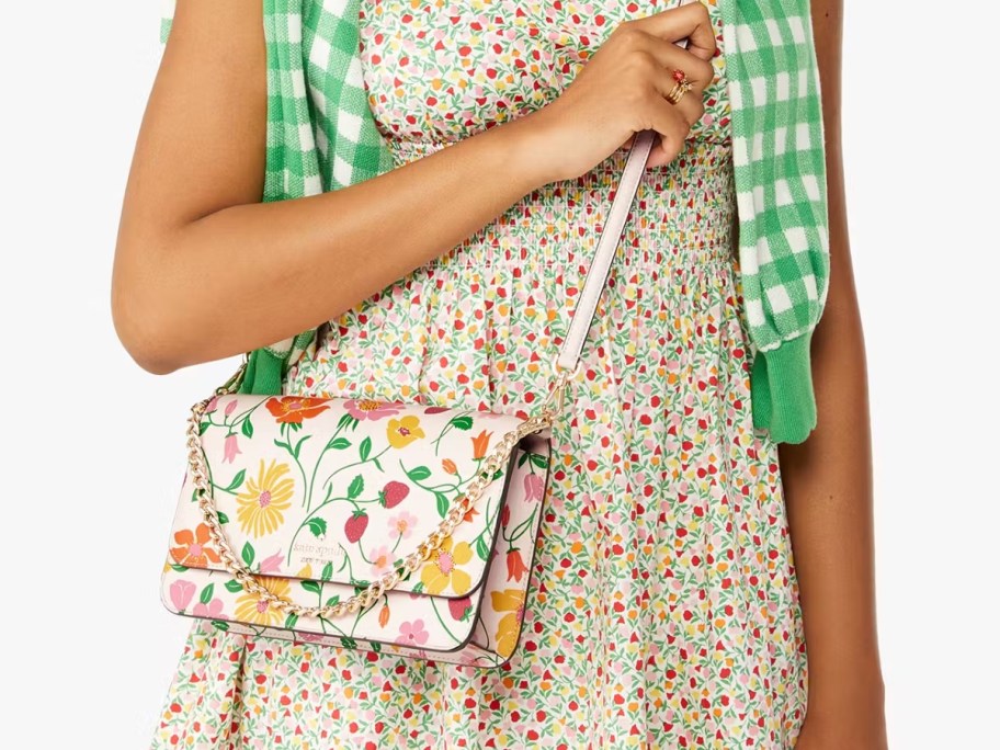 woman wearing a floral dress with a floral crossbody bag