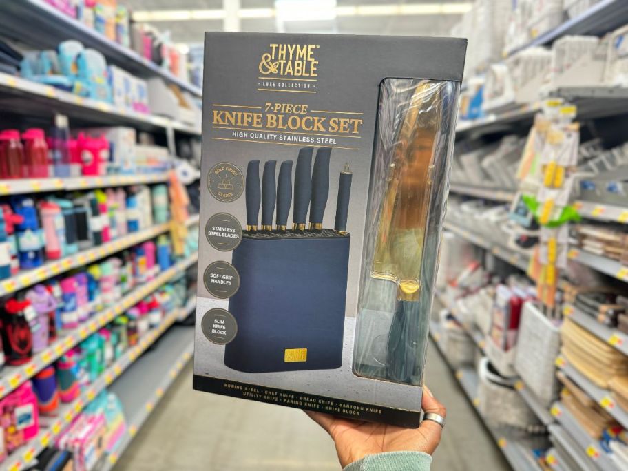 Thyme & Table 7-Piece Slim Block Knife Set with Gold Blades and Blue Block box being held by hand in aisle in store