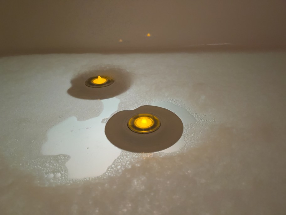 two floating candle diffusers in water