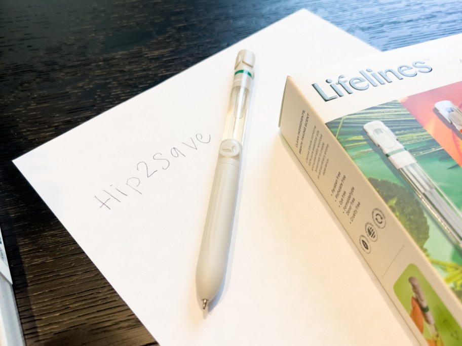 essential oil pen next to box