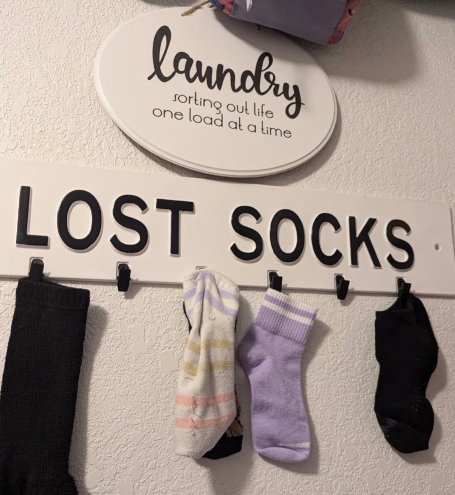 lost socks laundry solutions sign on wall
