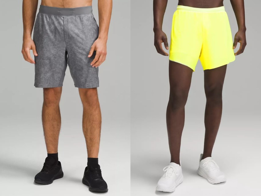 man wearing longer grey shorts next to a man wearing bright yellow shorter shorts