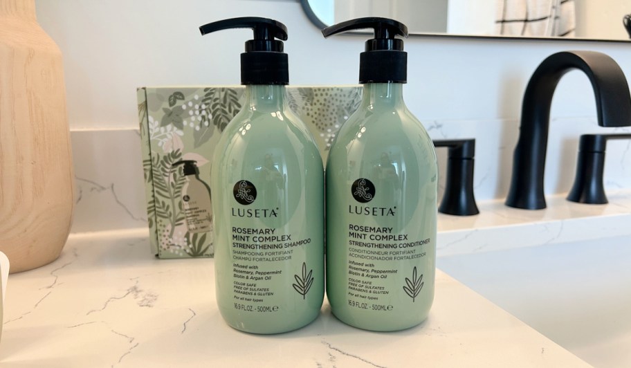 luseta Rosemary Mint shampoo and conditioner on a bathroom sink