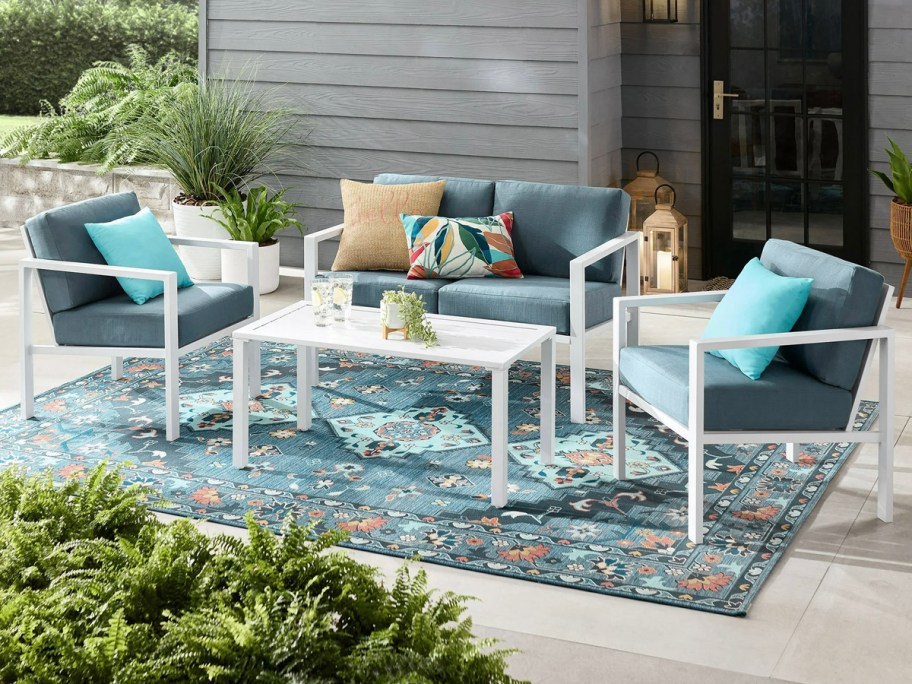 blue and white patio set outdoors on blue rug