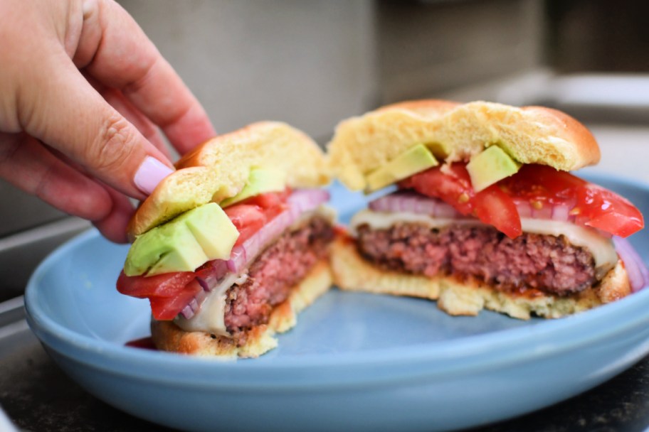 making a juicy grilled burger with toppings 