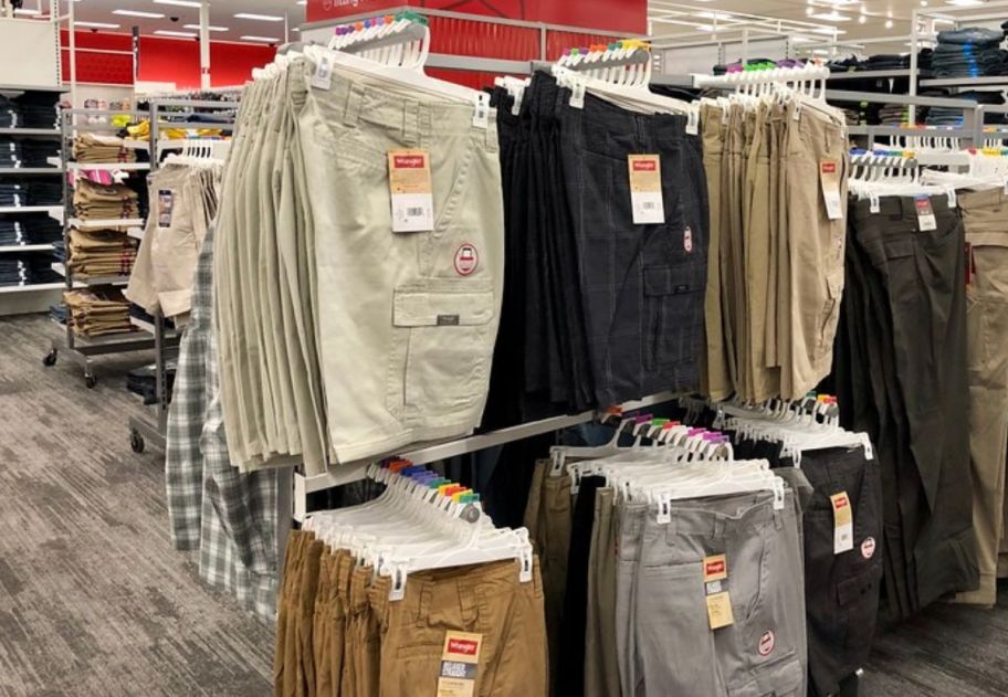 pairs of mens cargo shorts on a store rack