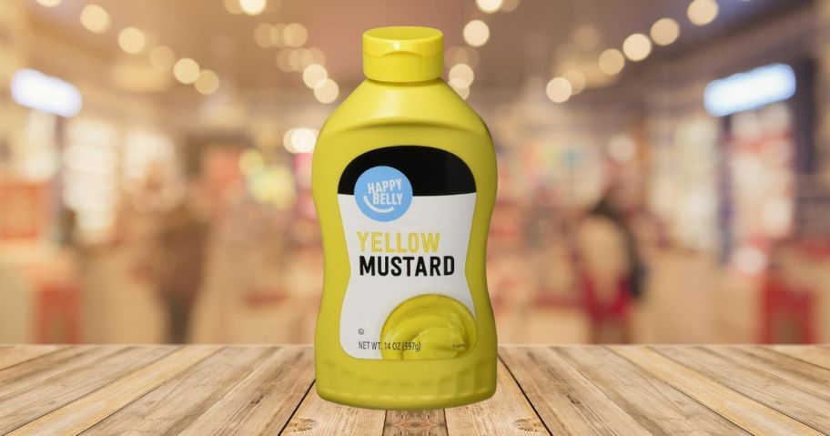 Amazon Brand - Happy Belly Yellow Mustard, Kosher, 14 ounce on picnic table