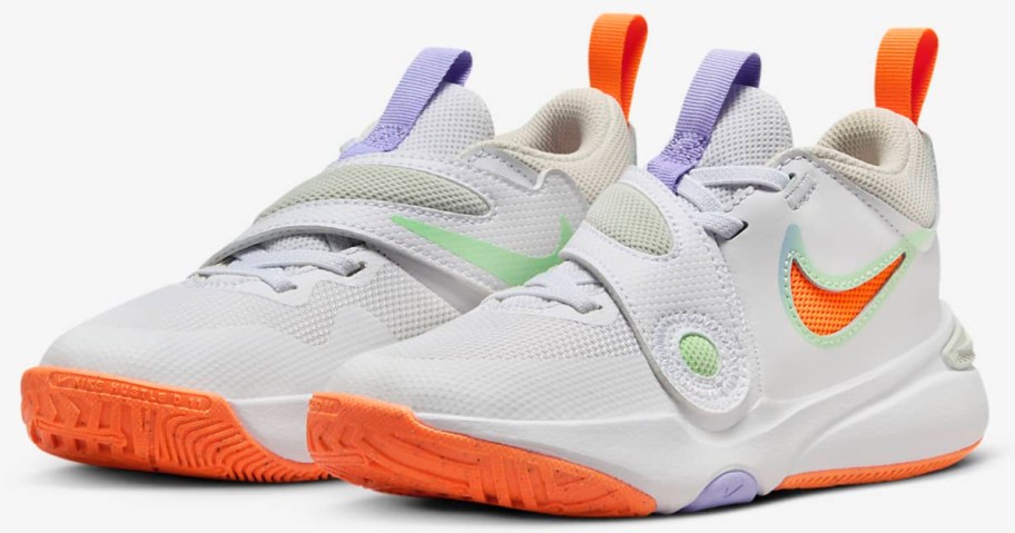 white Nike Team Hustle D 11
Little Kids' Shoes with orange, green and purple accents