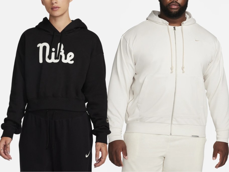 woman wearing a black Nike logo hoodie next to a man wearing a white Nike zip up hoodie