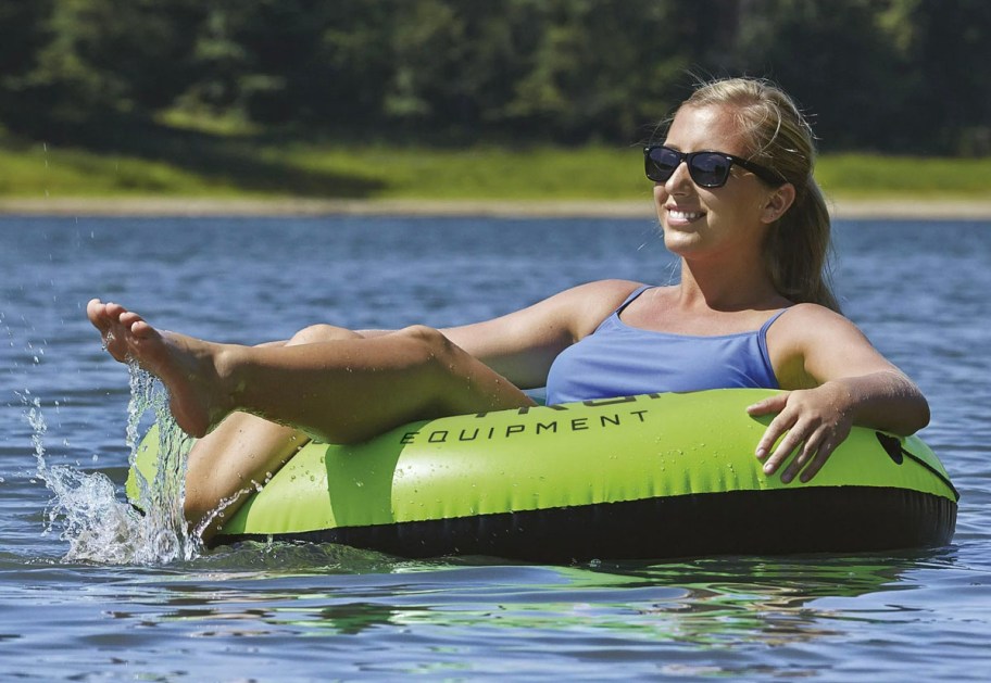 woman in green float in water
