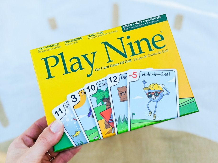 hand holding a Play Nine Card Game box