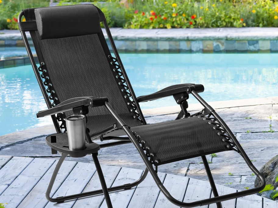 relaxing blacj chair from walmart displayed next to the pool