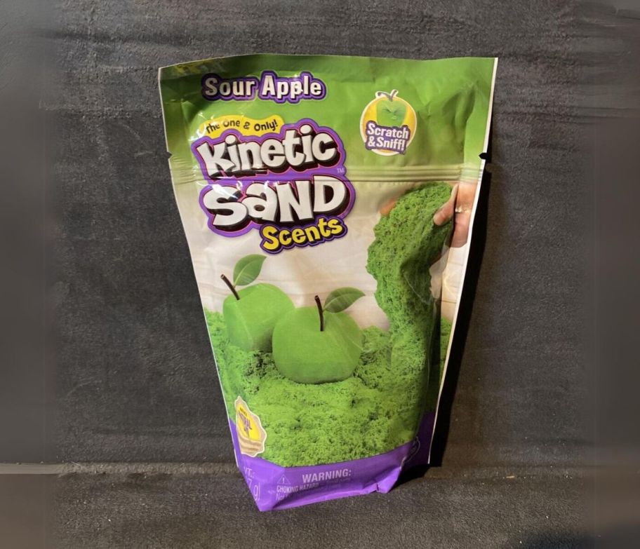 a bag of sour apple kinetic sand