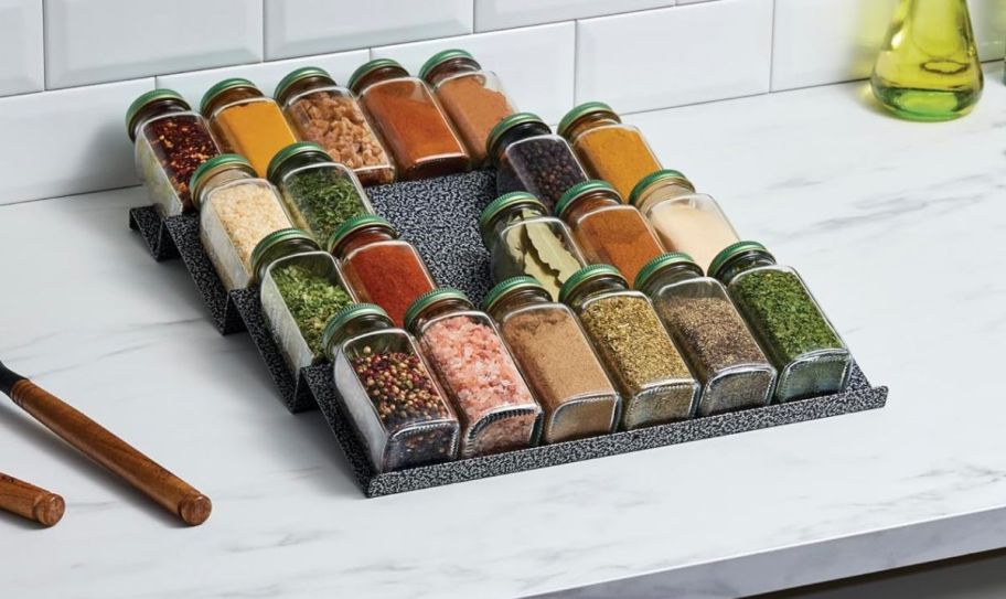 a single metal spice drawer organizer on a kitchen counter
