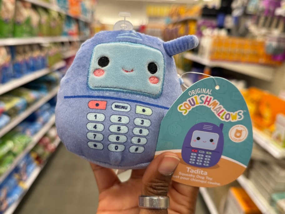 hand holding a c ell phone shaped Squishmallow pet toy