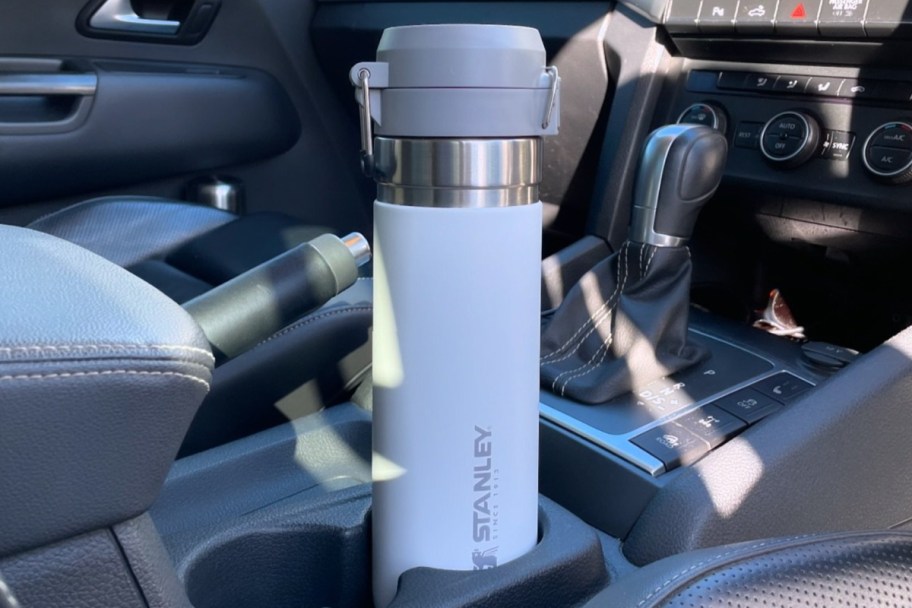 white water bottle in cupholder of car
