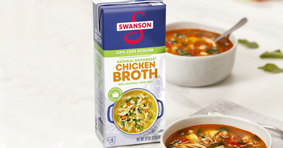 swanson chicken broth carton next to soup bowls 