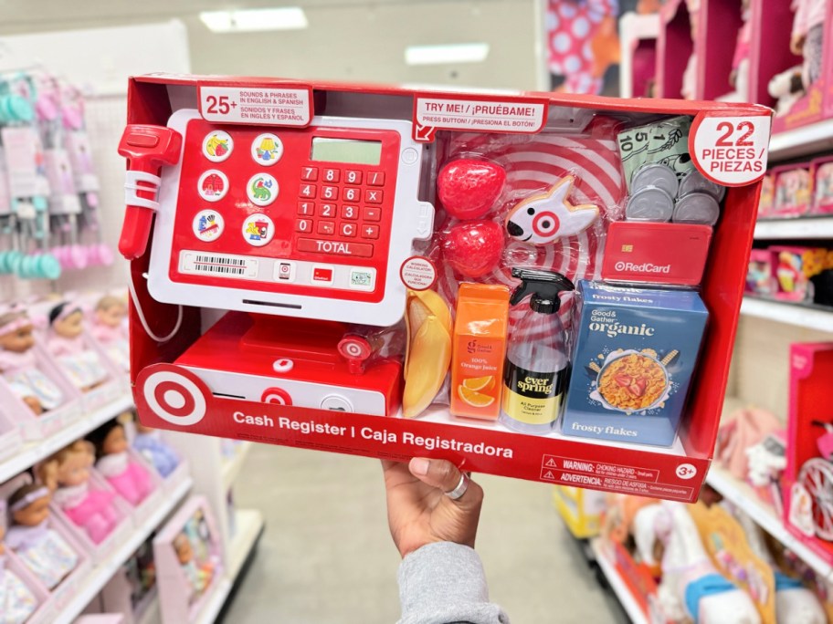 person holding up a target cash register packae