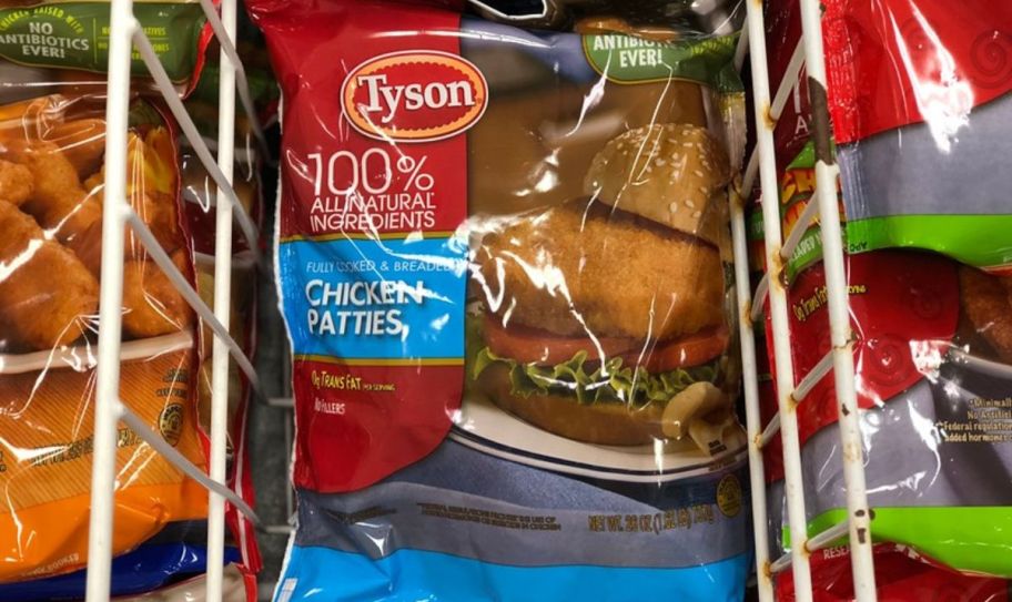 a bag of tyson frozen chicken patties in a freezer in a grocery store