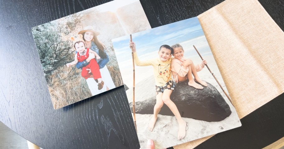 family pictures printed on metal on a table